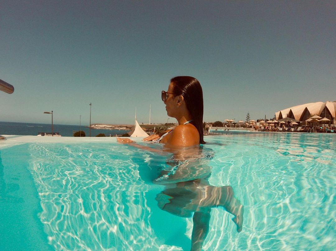 A woman looking to the distance in a swimming pool